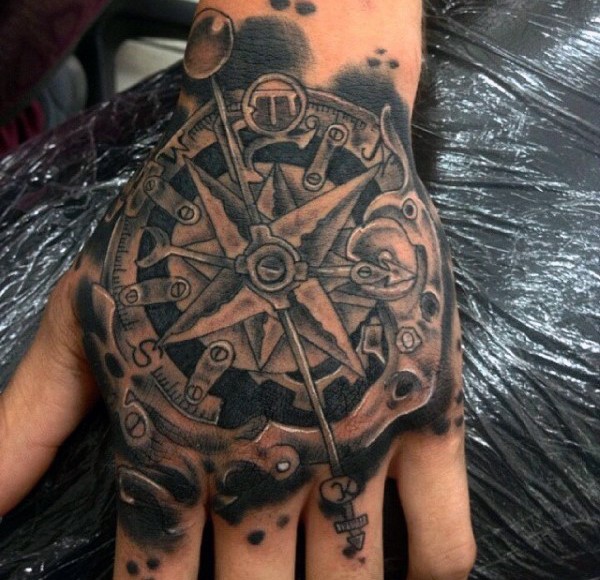 Abstract style black ink hand tattoo of mystical compass