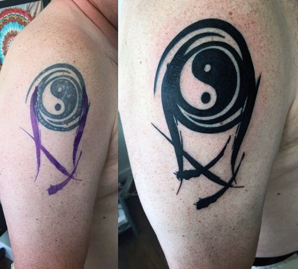 Abstract style black ink shoulder tattoo of Yin Yang symbol
