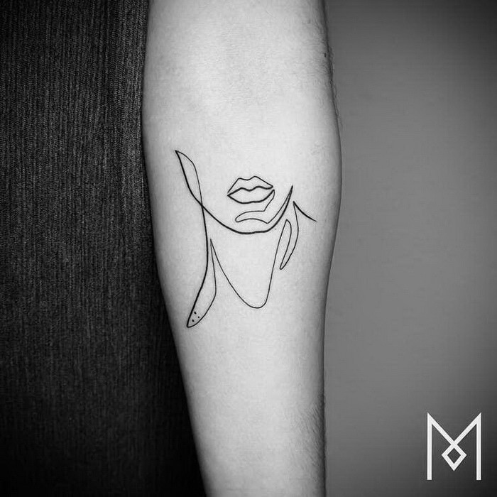 Abstract style black ink woman leaps tattoo on forearm