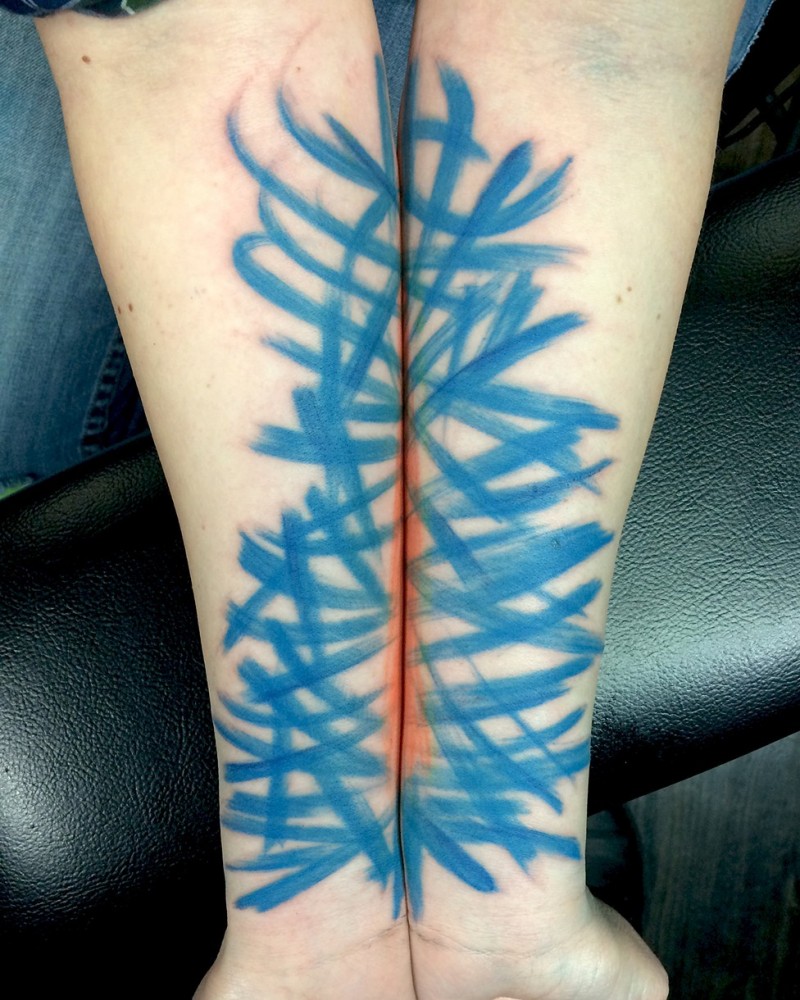 Abstract style blue colored forearm tattoo of various lines