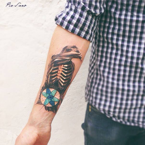 Abstract style colored arm tattoo of human skull with mysterious ornament