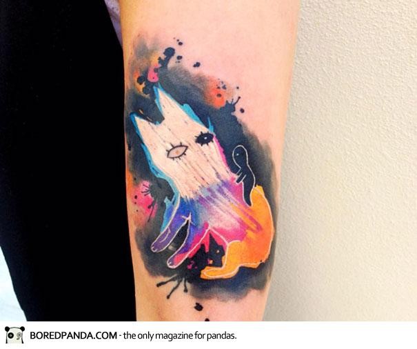 Abstract style colored arm tattoo of mystic creature with rider
