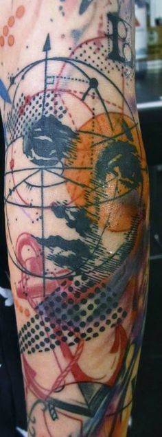 Abstract style colored arm tattoo of woman face with geometric picture