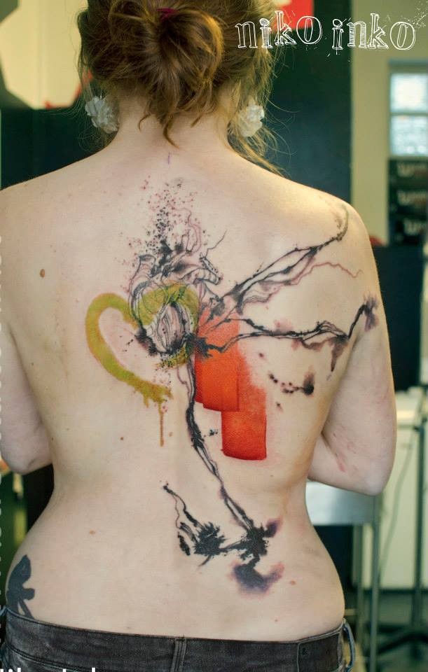 Abstract style colored back tattoo of human heart with various ornaments