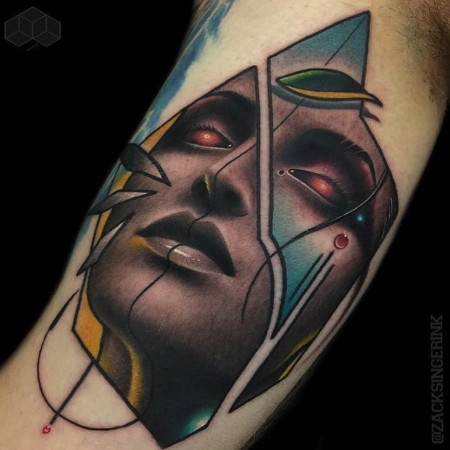 Abstract style colored biceps tattoo of demonic woman portrait