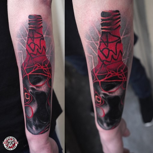 Abstract style colored bottle tattoo on forearm