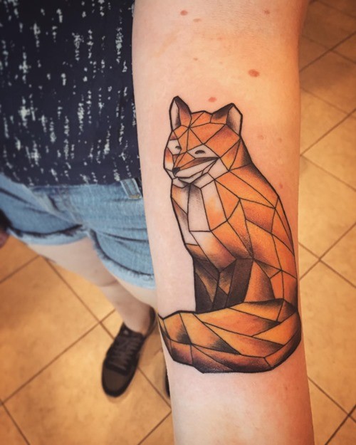 Abstract  style colored forearm tattoo of geometrical fox