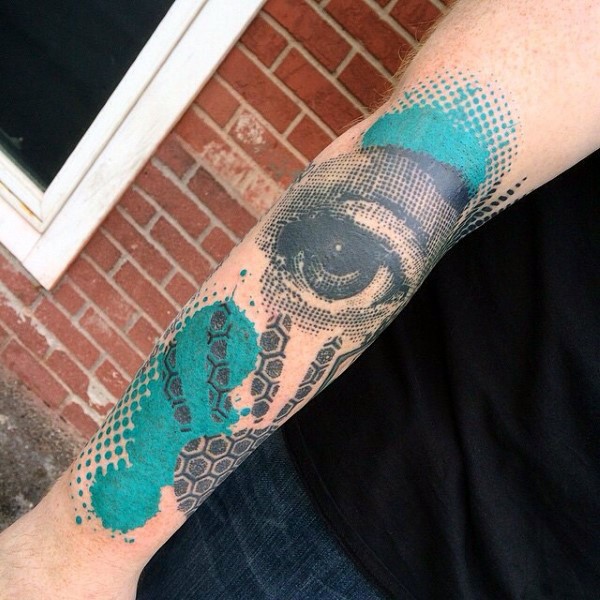 Abstract style colored forearm tattoo of human eye with ornaments