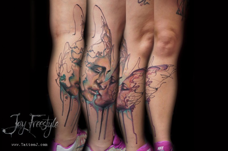 Abstract style colored leg tattoo of kissing couple