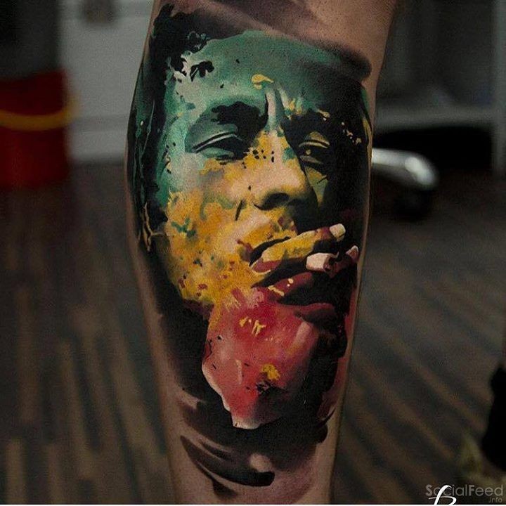 Abstract style colored leg tattoo of smoking man portrait