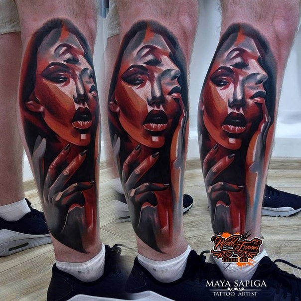 Abstract style colored leg tattoo of interesting woman faces