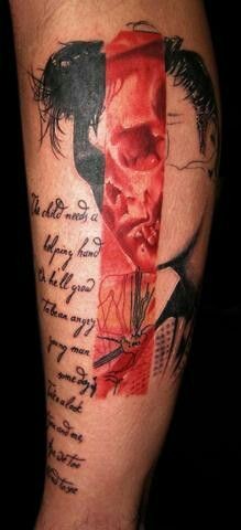 Abstract style colored leg tattoo of Elvis portrait with lettering