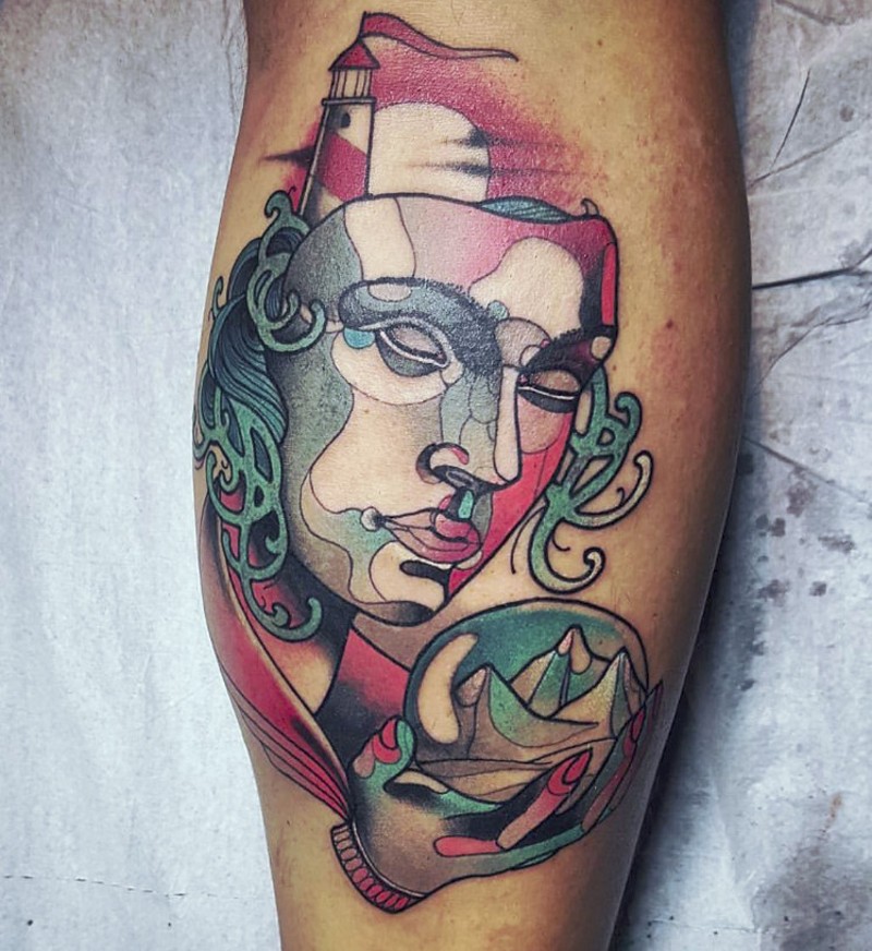Abstract style colored mask with lighthouse and orb tattoo on leg