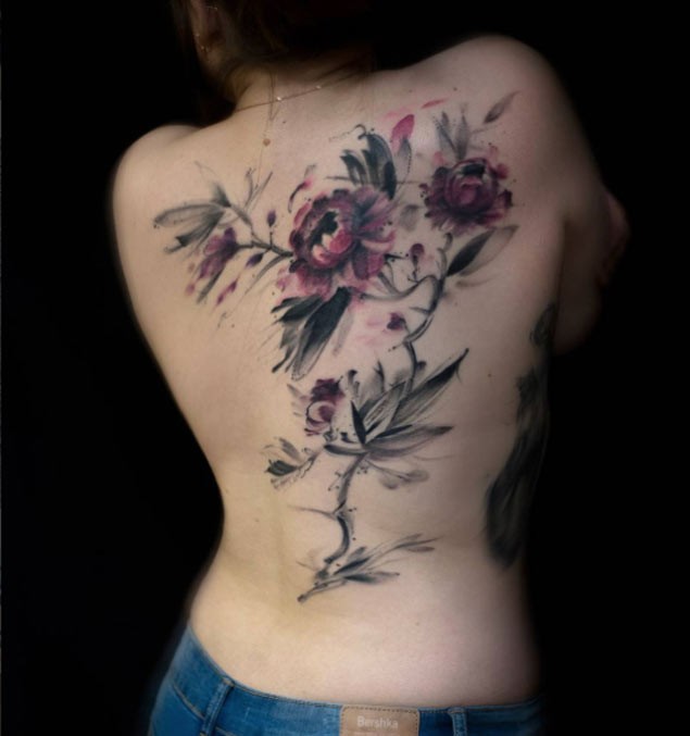 Abstract style colored massive back tattoo of wildflowers