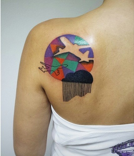 Abstract style colored scapular tattoo of geometrical figure with planes