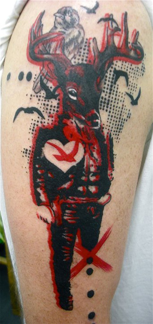 Abstract style colored shoulder tattoo of creepy deer with birds