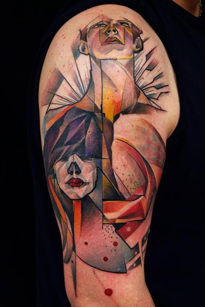 Abstract style colored shoulder tattoo of human portraits