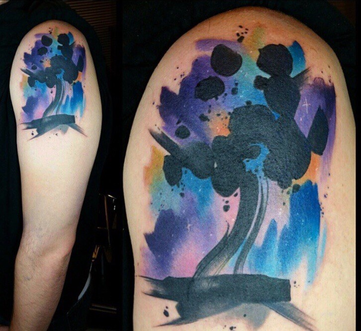 Abstract style colored shoulder tattoo stylized with night sky