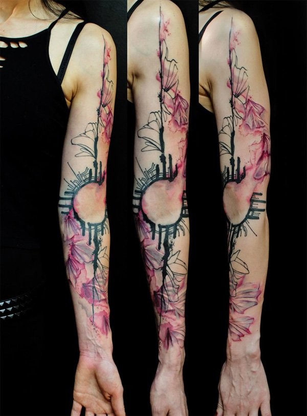 Abstract style colored sleeve tattoo of various wild flowers