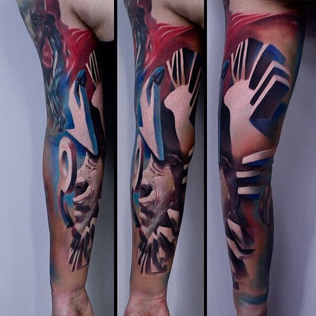 Abstract style colored sleeve tattoo of clock-face