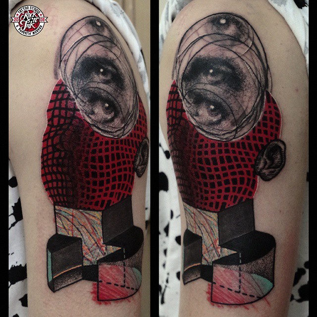 Abstract style colored surrealism shoulder tattoo