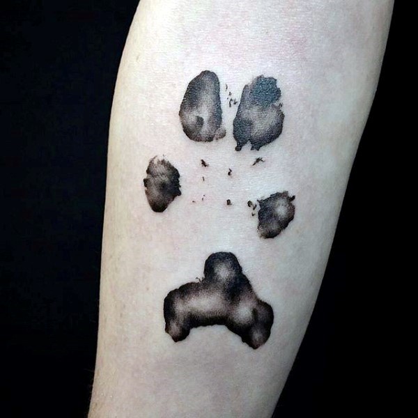 Abstract style colored tattoo of animal paw print