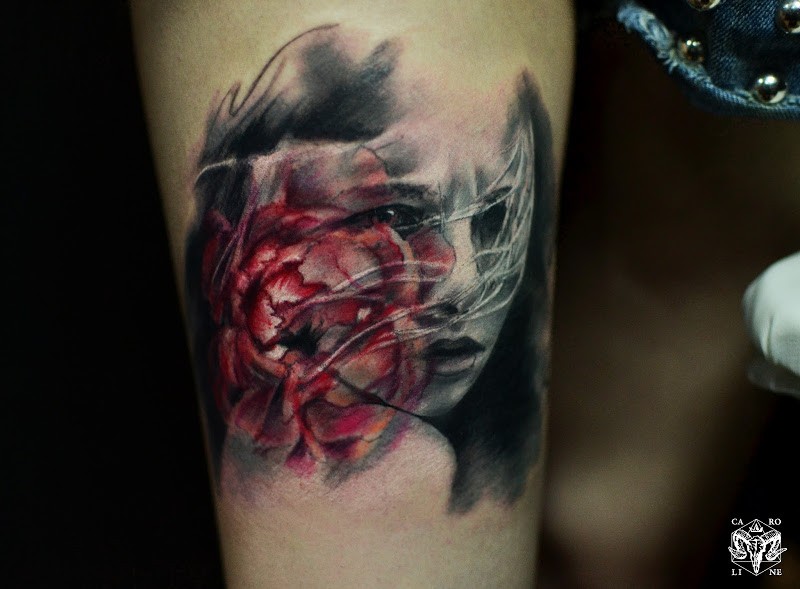 Abstract style colored thigh tattoo of woman face with heart