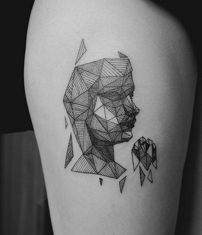 Abstract style geometrical portrait tattoo on thigh