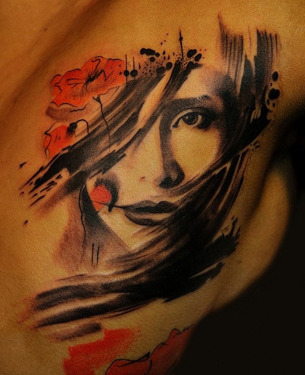 Abstract style half colored chest tattoo of woman portrait and wildflowers