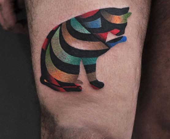 Abstract style multicolored cat shaped tattoo on thigh