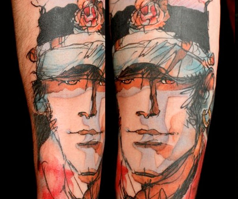 Abstract style multicolored man portrait tattoo on thigh