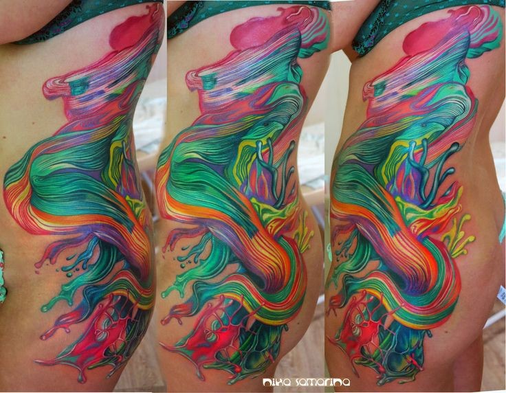 Abstract style multicolored side and thigh tattoo