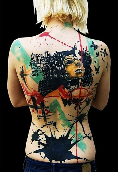 Abstract style multicolored whole back tattoo with mask, butterflies and paint drips