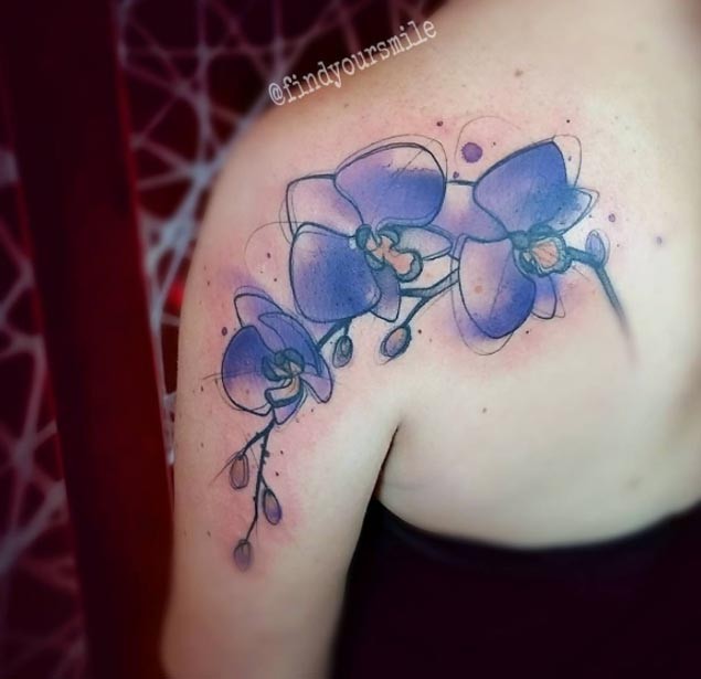 Abstract style painted and colored flowers tattoo on shoulder zone
