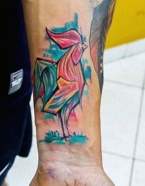 Abstract style painted colorful cock tattoo on wrist