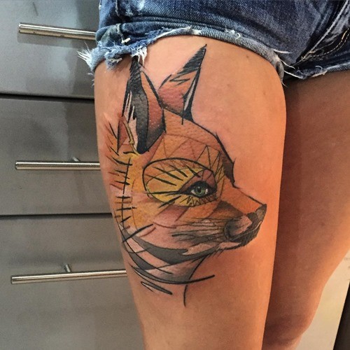 Abstract style painted natural colored fox tattoo on thigh