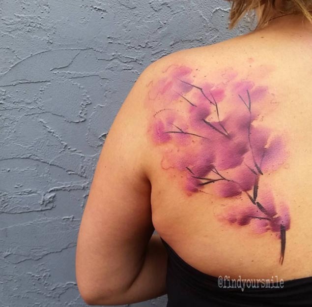 Abstract style pink colored tree flowers tattoo on back zone