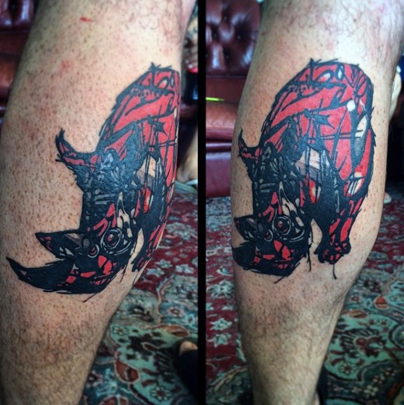 Abstract style red colored leg tattoo of small rhino
