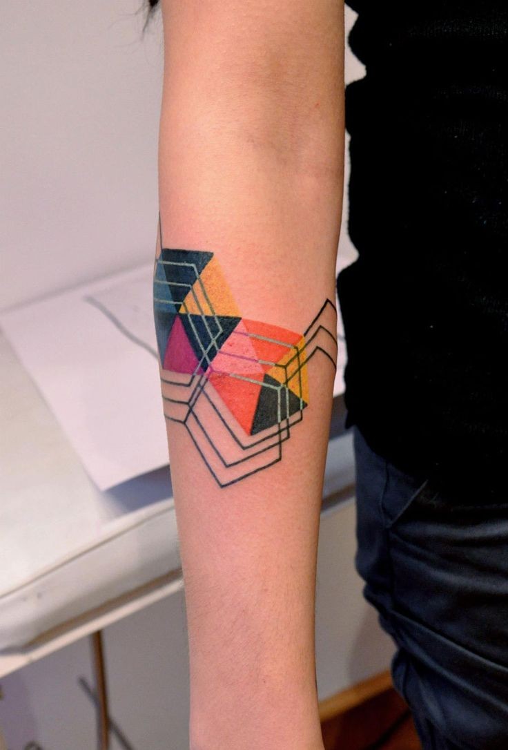 Abstract style simple colored geometrical tattoo on arm
