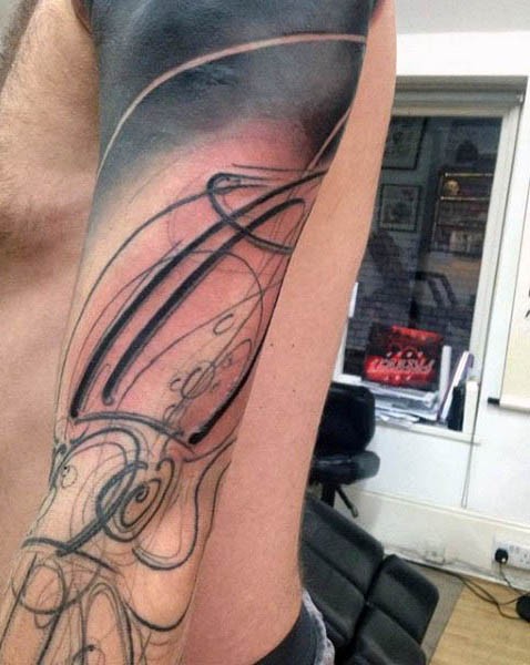 Abstract style unfinished squid tattoo on sleeve