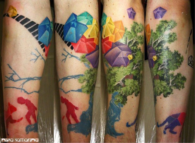 Abstract style unusual looking colored forearm tattoo of tree with diamonds