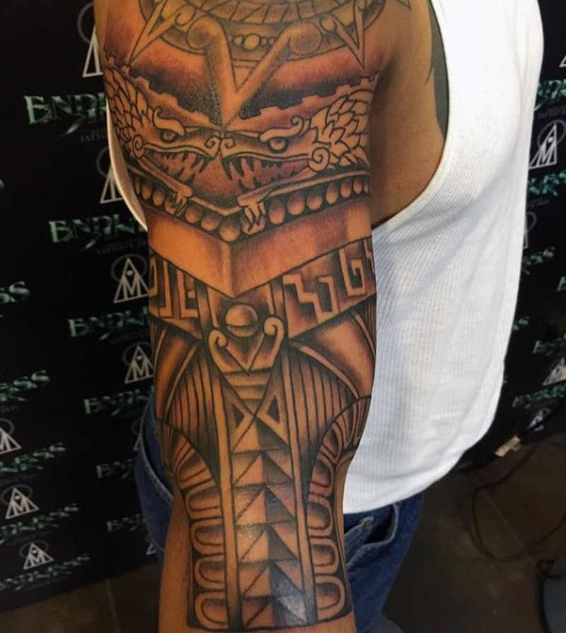 Accurate black and white antic armor like colored forearm tattoo