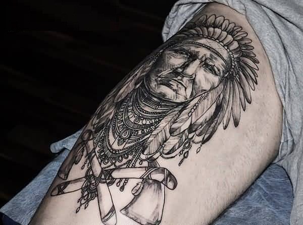 Accurate black and white detailed Indian portrait on thigh with crossed axes