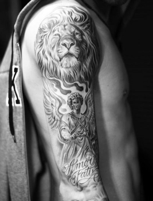 Accurate black and white lion tattoo on shoulder with angel and lettering