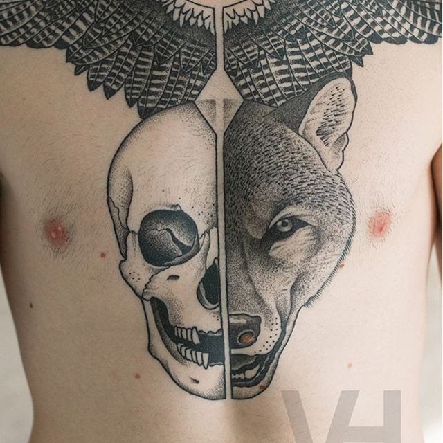 Accurate black ink chest tattoo designed by Valentin Hirsch of fox and human skulls