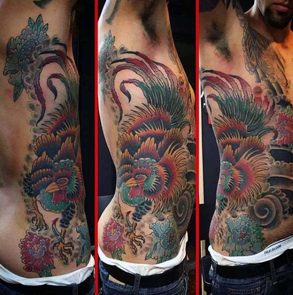 Accurate colored big realistic looking cock tattoo on side