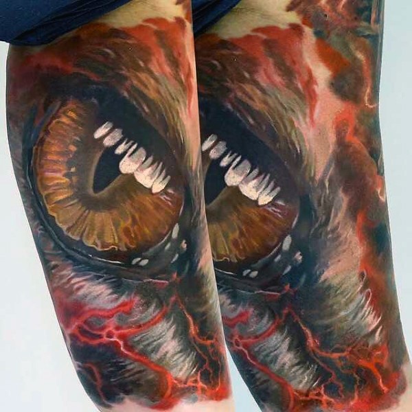Accurate painted and colored mystic dragon eye tattoo on arm