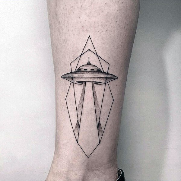 Accurate painted black and white alien ship with geometrical figures tattoo on ankle