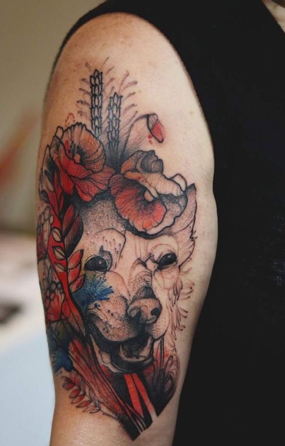 Accurate painted by Joanna Swirska upper arm tattoo of bear with flowers