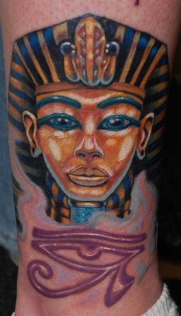 Accurate painted natural looking colored Egypt statue tattoo on ankle with mystic symbol
